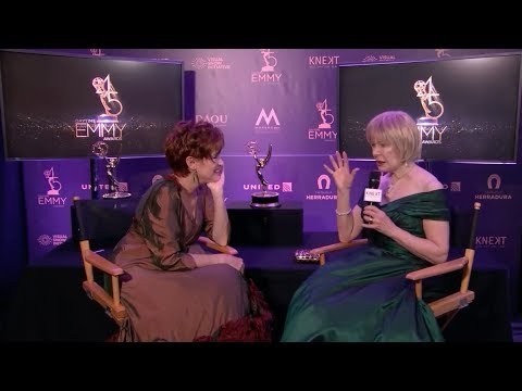 Loretta Swit backstage at the Daytime Emmys interviewed by Carolyn Hennesy. They discuss Jamie Farr, Mister Rogers, MASH, and Ivey Abitz.