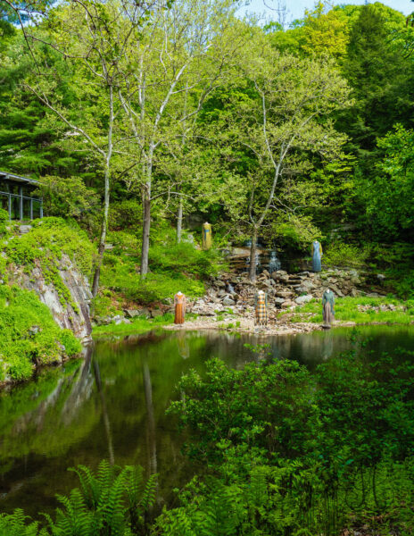Ivey Abitz bespoke clothing on a waterfall.