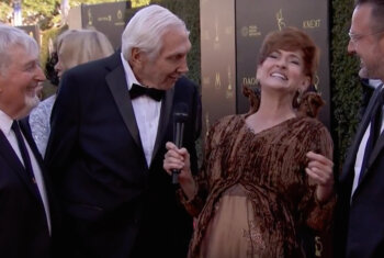 Carolyn Hennesy wears Ivey Abitz on the Emmys red carpet whilst interviewing Sid Krofft, Marty Krofft, and David Arquette
