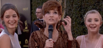 Carolyn Hennesy wears Ivey Abitz on the Emmys red carpet whilst interviewing cast from Free Rein on Netflix