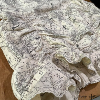 Clemmie Frock in a lighthearted map print.