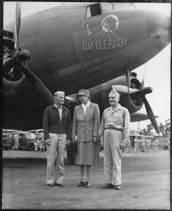 Eleanor Roosevelt with Lt. General Millard F. Harmon (left) and Admiral William F. Halsey in front of the plane "Our Eleanor" in the South Pacific.. Courtesy FDR Library.