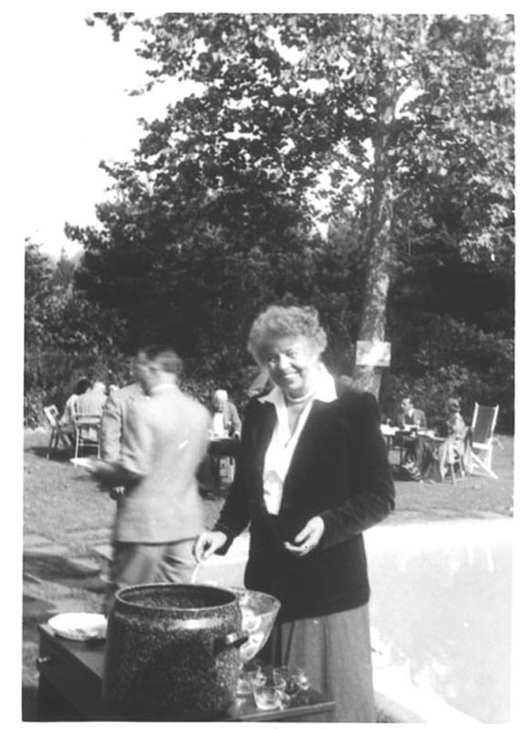 Eleanor hosting a picnic and welcoming guests on east side of Stone Cottage at Val-Kill, Hyde Park, New York, 1946.