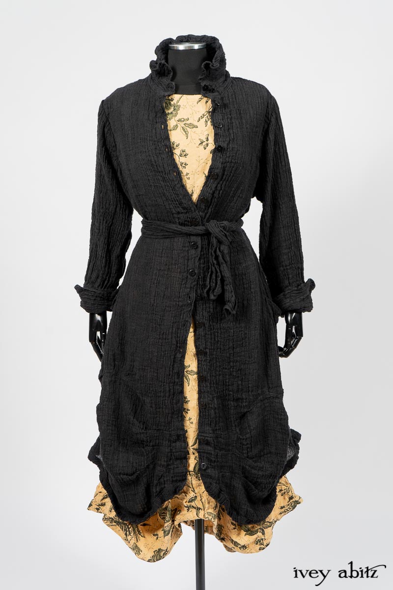 Scattergood Duster Coat in Black Crinkled Washed Linen; Scattergood Frock in Arthurian Green Floral Washed Linen. By Ivey Abitz