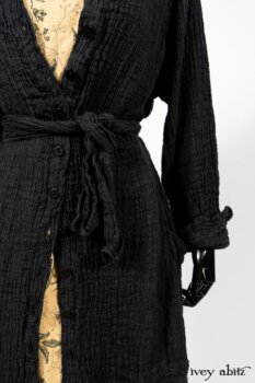 Scattergood Duster Coat in Black Crinkled Washed Linen; Scattergood Frock in Arthurian Green Floral Washed Linen. By Ivey Abitz