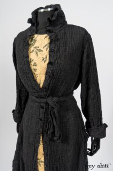 Scattergood Duster Coat in Black Crinkled Washed Linen; Scattergood Frock in Arthurian Green Floral Washed Linen. By Ivey Abitz