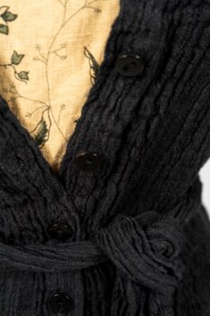 Scattergood Duster Coat in Black Crinkled Washed Linen; Scattergood Frock in Arthurian Green Floral Washed Linen. By Ivey Abitz