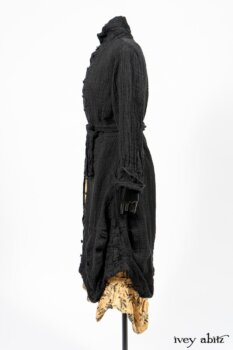 Scattergood Duster Coat in Black Crinkled Washed Linen; Scattergood Frock in Arthurian Green Floral Washed Linen. By Ivey Abitz