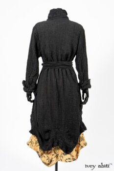 Scattergood Duster Coat in Black Crinkled Washed Linen; Scattergood Frock in Arthurian Green Floral Washed Linen. By Ivey Abitz