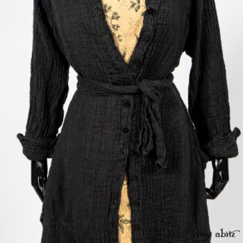 Scattergood Duster Coat in Black Crinkled Washed Linen; Scattergood Frock in Arthurian Green Floral Washed Linen. By Ivey Abitz