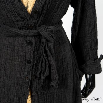 Scattergood Duster Coat in Black Crinkled Washed Linen; Scattergood Frock in Arthurian Green Floral Washed Linen. By Ivey Abitz