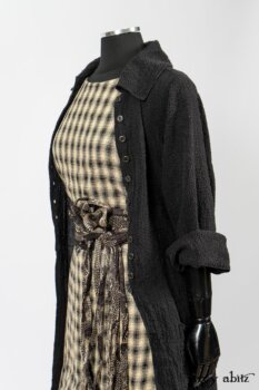 Elsie Duster Coat in Black Puckered Check Weave; Blanchefleur Frock in Black and Natural Plaid Weave; Porte Cochere Sash in Black and Natural Embroidered Floral Weave. By Ivey Abitz