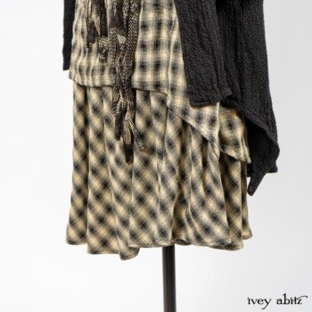 Elsie Duster Coat in Black Puckered Check Weave; Blanchefleur Frock in Black and Natural Plaid Weave; Porte Cochere Sash in Black and Natural Embroidered Floral Weave. By Ivey Abitz