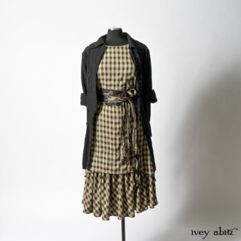 Elsie Duster Coat in Black Puckered Check Weave; Blanchefleur Frock in Black and Natural Plaid Weave; Porte Cochere Sash in Black and Natural Embroidered Floral Weave. By Ivey Abitz