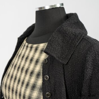 Elsie Duster Coat in Black Puckered Check Weave; Blanchefleur Frock in Black and Natural Plaid Weave; Porte Cochere Sash in Black and Natural Embroidered Floral Weave. By Ivey Abitz