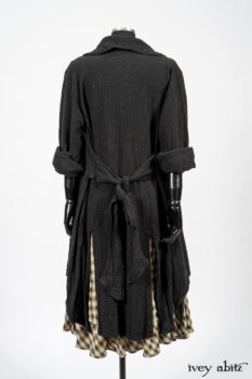Elsie Duster Coat in Black Puckered Check Weave; Blanchefleur Frock in Black and Natural Plaid Weave; Porte Cochere Sash in Black and Natural Embroidered Floral Weave. By Ivey Abitz