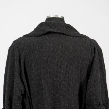 Elsie Duster Coat in Black Puckered Check Weave; Blanchefleur Frock in Black and Natural Plaid Weave; Porte Cochere Sash in Black and Natural Embroidered Floral Weave. By Ivey Abitz