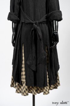 Elsie Duster Coat in Black Puckered Check Weave; Blanchefleur Frock in Black and Natural Plaid Weave; Porte Cochere Sash in Black and Natural Embroidered Floral Weave. By Ivey Abitz