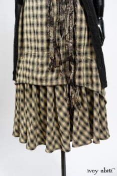Elsie Duster Coat in Black Puckered Check Weave; Blanchefleur Frock in Black and Natural Plaid Weave; Porte Cochere Sash in Black and Natural Embroidered Floral Weave. By Ivey Abitz