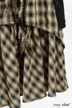 Elsie Duster Coat in Black Puckered Check Weave; Blanchefleur Frock in Black and Natural Plaid Weave; Porte Cochere Sash in Black and Natural Embroidered Floral Weave. By Ivey Abitz
