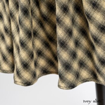 Elsie Duster Coat in Black Puckered Check Weave; Blanchefleur Frock in Black and Natural Plaid Weave; Porte Cochere Sash in Black and Natural Embroidered Floral Weave. By Ivey Abitz
