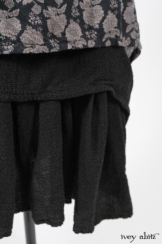 Wildefield Frock in Wolfie Grey Floral Voile; Limited Edition Blanchefleur Sash in Wolfie Grey Floral Voile; Blanchefleur Frock in Black Puckered Check Weave. By Ivey Abitz