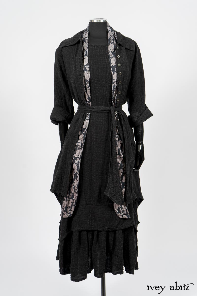 Elsie Duster Coat in Black Puckered Check Weave; Limited Edition Blanchefleur Sash in Wolfie Grey Floral Voile; Blanchefleur Frock in Black Puckered Check Weave. By Ivey Abitz