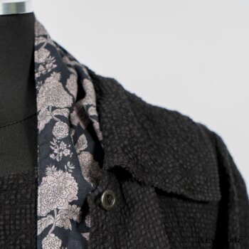 Elsie Duster Coat in Black Puckered Check Weave; Limited Edition Blanchefleur Sash in Wolfie Grey Floral Voile; Blanchefleur Frock in Black Puckered Check Weave. By Ivey Abitz