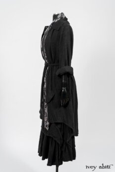 Elsie Duster Coat in Black Puckered Check Weave; Limited Edition Blanchefleur Sash in Wolfie Grey Floral Voile; Blanchefleur Frock in Black Puckered Check Weave. By Ivey Abitz