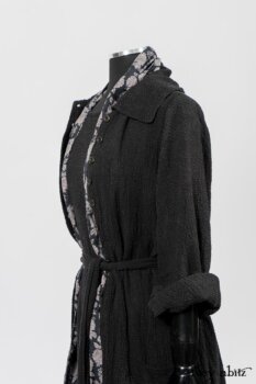 Elsie Duster Coat in Black Puckered Check Weave; Limited Edition Blanchefleur Sash in Wolfie Grey Floral Voile; Blanchefleur Frock in Black Puckered Check Weave. By Ivey Abitz