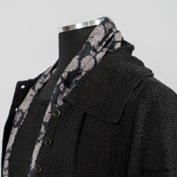 Elsie Duster Coat in Black Puckered Check Weave; Limited Edition Blanchefleur Sash in Wolfie Grey Floral Voile; Blanchefleur Frock in Black Puckered Check Weave. By Ivey Abitz