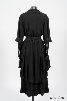 Elsie Duster Coat in Black Puckered Check Weave; Limited Edition Blanchefleur Sash in Wolfie Grey Floral Voile; Blanchefleur Frock in Black Puckered Check Weave. By Ivey Abitz