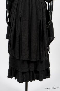 Elsie Duster Coat in Black Puckered Check Weave; Limited Edition Blanchefleur Sash in Wolfie Grey Floral Voile; Blanchefleur Frock in Black Puckered Check Weave. By Ivey Abitz