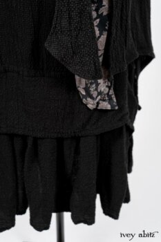 Elsie Duster Coat in Black Puckered Check Weave; Limited Edition Blanchefleur Sash in Wolfie Grey Floral Voile; Blanchefleur Frock in Black Puckered Check Weave. By Ivey Abitz