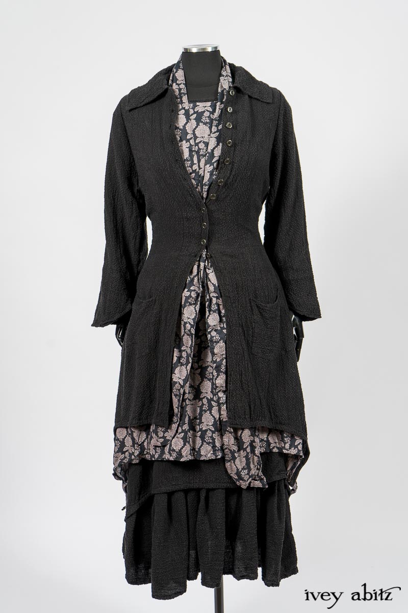 Elsie Duster Coat in Black Puckered Check Weave; Limited Edition Blanchefleur Sash in Wolfie Grey Floral Voile; Wildefield Frock in Wolfie Grey Floral Voile; Blanchefleur Frock in Black Puckered Check Weave. By Ivey Abitz