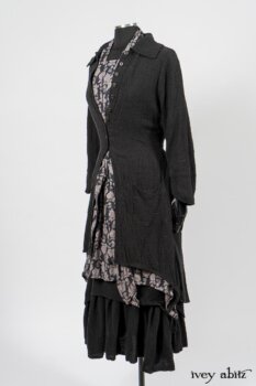 Elsie Duster Coat in Black Puckered Check Weave; Limited Edition Blanchefleur Sash in Wolfie Grey Floral Voile; Wildefield Frock in Wolfie Grey Floral Voile; Blanchefleur Frock in Black Puckered Check Weave. By Ivey Abitz