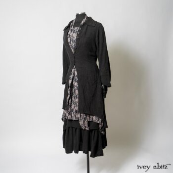 Elsie Duster Coat in Black Puckered Check Weave; Limited Edition Blanchefleur Sash in Wolfie Grey Floral Voile; Wildefield Frock in Wolfie Grey Floral Voile; Blanchefleur Frock in Black Puckered Check Weave. By Ivey Abitz