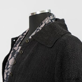 Elsie Duster Coat in Black Puckered Check Weave; Limited Edition Blanchefleur Sash in Wolfie Grey Floral Voile; Wildefield Frock in Wolfie Grey Floral Voile; Blanchefleur Frock in Black Puckered Check Weave. By Ivey Abitz