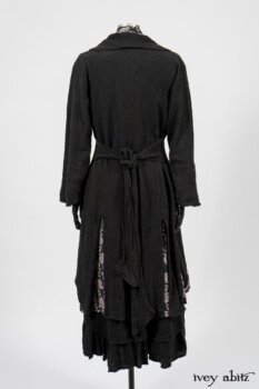 Elsie Duster Coat in Black Puckered Check Weave; Limited Edition Blanchefleur Sash in Wolfie Grey Floral Voile; Wildefield Frock in Wolfie Grey Floral Voile; Blanchefleur Frock in Black Puckered Check Weave. By Ivey Abitz