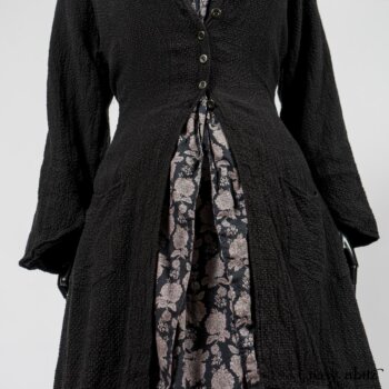 Elsie Duster Coat in Black Puckered Check Weave; Limited Edition Blanchefleur Sash in Wolfie Grey Floral Voile; Wildefield Frock in Wolfie Grey Floral Voile; Blanchefleur Frock in Black Puckered Check Weave. By Ivey Abitz