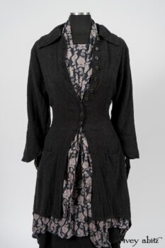 Elsie Duster Coat in Black Puckered Check Weave; Limited Edition Blanchefleur Sash in Wolfie Grey Floral Voile; Wildefield Frock in Wolfie Grey Floral Voile; Blanchefleur Frock in Black Puckered Check Weave. By Ivey Abitz