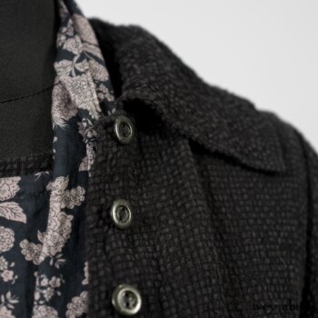 Elsie Duster Coat in Black Puckered Check Weave; Limited Edition Blanchefleur Sash in Wolfie Grey Floral Voile; Wildefield Frock in Wolfie Grey Floral Voile; Blanchefleur Frock in Black Puckered Check Weave. By Ivey Abitz