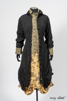 Scattergood Duster Coat in Black Crinkled Washed Linen; Scattergood Frock in Arthurian Green Floral Washed Linen; Truitt Shirt in Peace and Civility Stripe Linen. By Ivey Abitz