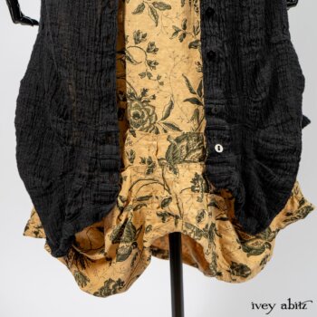 Scattergood Duster Coat in Black Crinkled Washed Linen; Scattergood Frock in Arthurian Green Floral Washed Linen; Truitt Shirt in Peace and Civility Stripe Linen. By Ivey Abitz