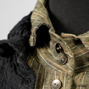 Scattergood Duster Coat in Black Crinkled Washed Linen; Scattergood Frock in Arthurian Green Floral Washed Linen; Truitt Shirt in Peace and Civility Stripe Linen. By Ivey Abitz