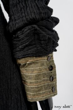 Scattergood Duster Coat in Black Crinkled Washed Linen; Scattergood Frock in Arthurian Green Floral Washed Linen; Truitt Shirt in Peace and Civility Stripe Linen. By Ivey Abitz