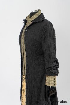 Scattergood Duster Coat in Black Crinkled Washed Linen; Scattergood Frock in Arthurian Green Floral Washed Linen; Truitt Shirt in Peace and Civility Stripe Linen. By Ivey Abitz