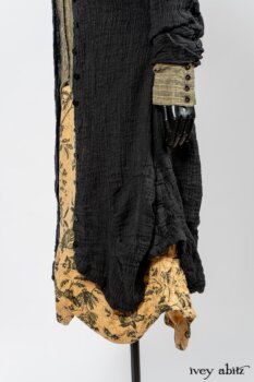 Scattergood Duster Coat in Black Crinkled Washed Linen; Scattergood Frock in Arthurian Green Floral Washed Linen; Truitt Shirt in Peace and Civility Stripe Linen. By Ivey Abitz