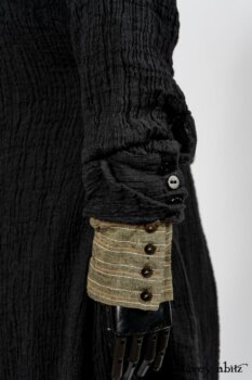 Scattergood Duster Coat in Black Crinkled Washed Linen; Scattergood Frock in Arthurian Green Floral Washed Linen; Truitt Shirt in Peace and Civility Stripe Linen. By Ivey Abitz