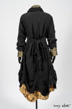 Scattergood Duster Coat in Black Crinkled Washed Linen; Scattergood Frock in Arthurian Green Floral Washed Linen; Truitt Shirt in Peace and Civility Stripe Linen. By Ivey Abitz